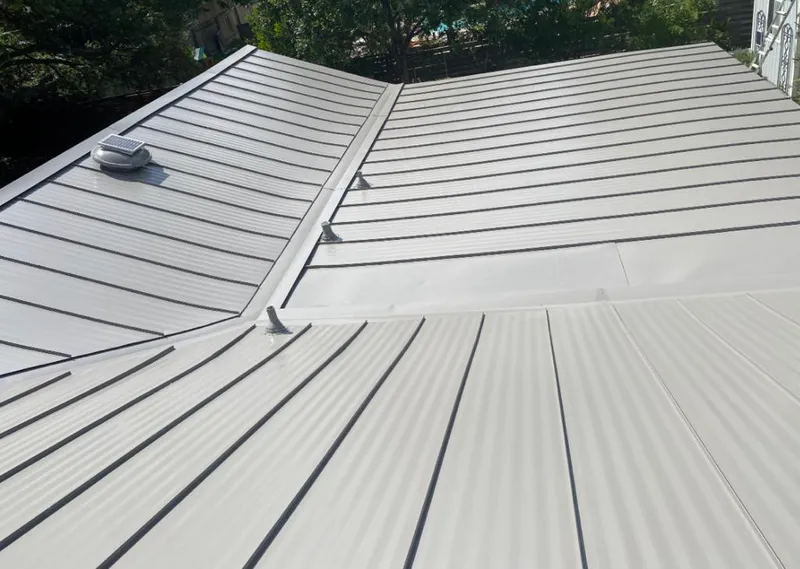 Solar attic fan installed on a metal roof for Roof Ventilation in North Little Rock
